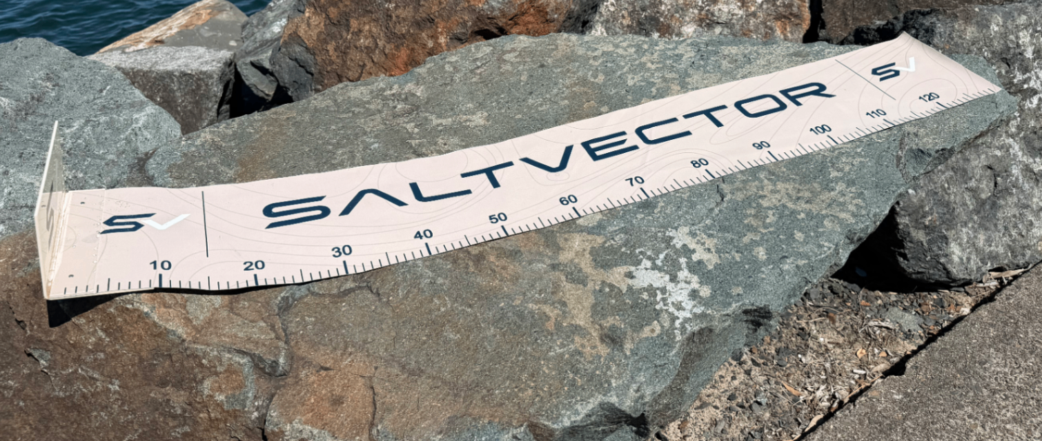 Angled view of the SALTVECTOR Brag Mat on coastal rock
